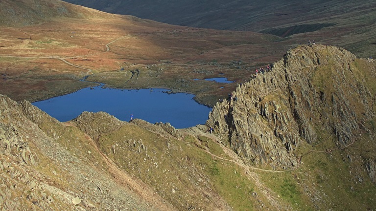 The knife-edge ridge of Striding Edge on Helvellyn in the Lake District National Park, a popular walk for experienced walkers